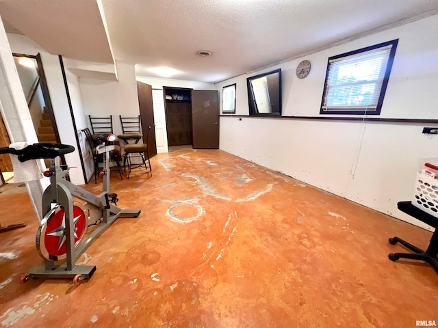 workout area featuring concrete floors