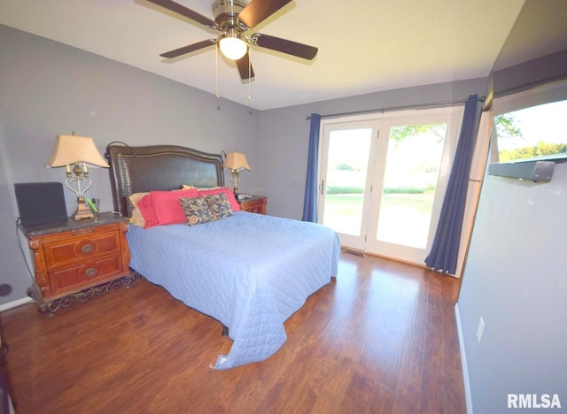 bedroom featuring dark wood-type flooring, ceiling fan, and access to outside