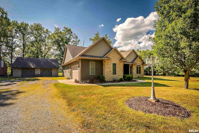 craftsman-style house with a garage and a front lawn