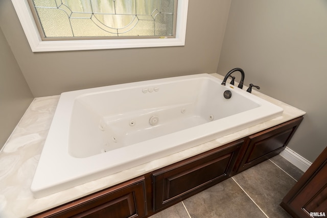 full bathroom featuring tile patterned flooring and a jetted tub