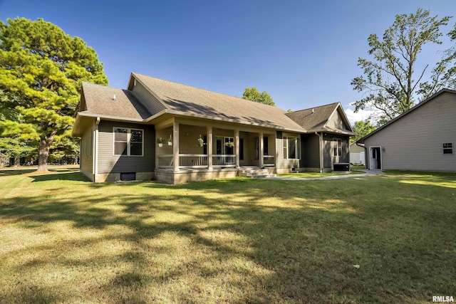 view of front of home featuring covered porch, a shingled roof, a front lawn, and central AC