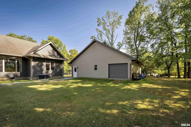 view of side of property featuring central air condition unit, a lawn, and roof with shingles