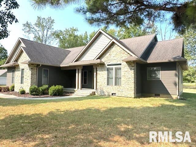 craftsman inspired home with crawl space, stone siding, a shingled roof, and a front yard