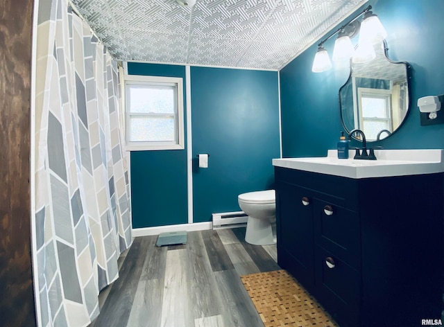 bathroom featuring hardwood / wood-style flooring, toilet, a shower with curtain, a baseboard radiator, and vanity