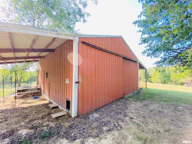 view of outbuilding with a carport