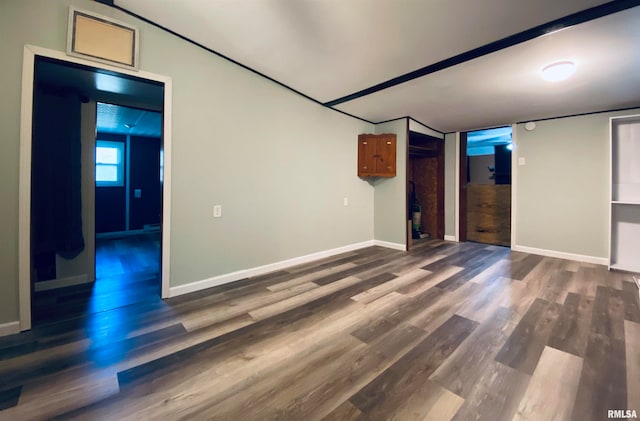 basement featuring dark hardwood / wood-style floors