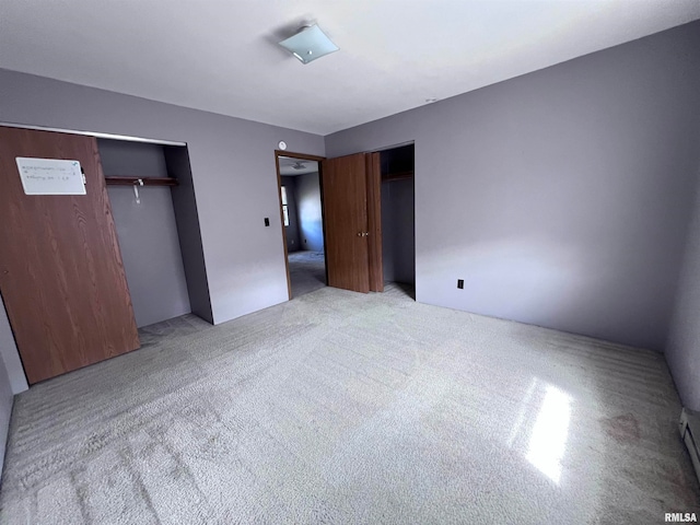 unfurnished bedroom with light colored carpet