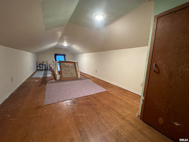 bonus room featuring hardwood / wood-style flooring and lofted ceiling