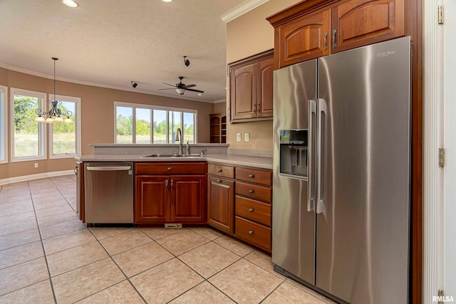 kitchen with ceiling fan, appliances with stainless steel finishes, light tile patterned floors, and sink