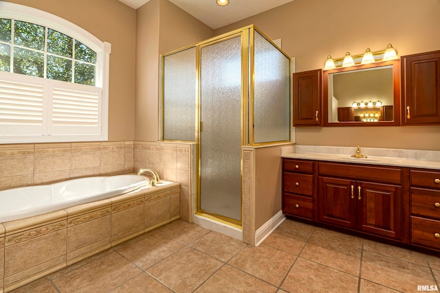 bathroom with vanity, tile patterned flooring, and separate shower and tub