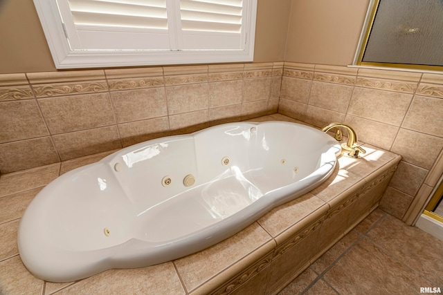 bathroom featuring tile walls, tile patterned flooring, and tiled bath