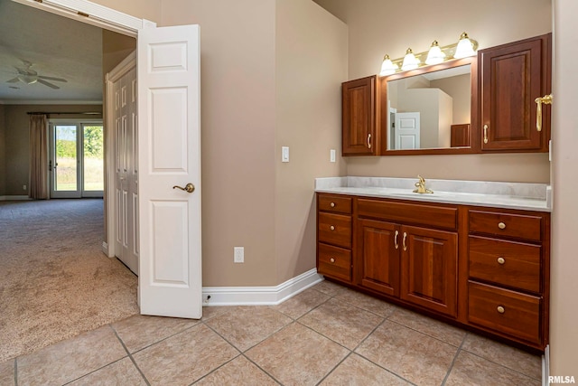 bathroom featuring ceiling fan, vanity, and tile patterned floors