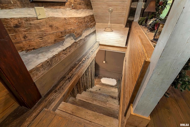 stairway with hardwood / wood-style floors