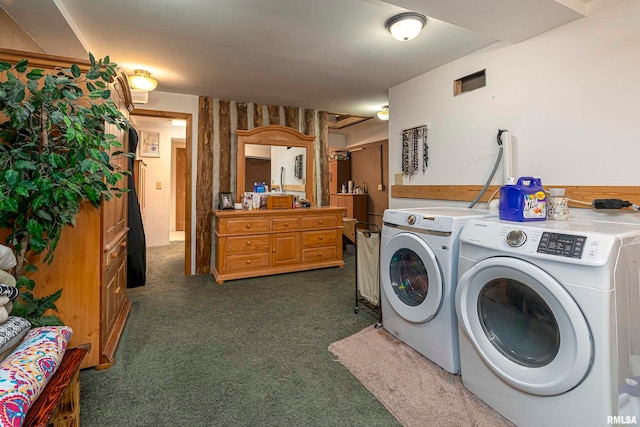 laundry room with dark carpet and independent washer and dryer