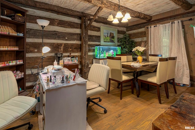 dining room with wood ceiling, beam ceiling, wood-type flooring, wooden walls, and an inviting chandelier