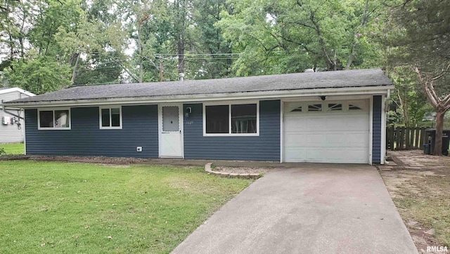 ranch-style house with a garage and a front lawn