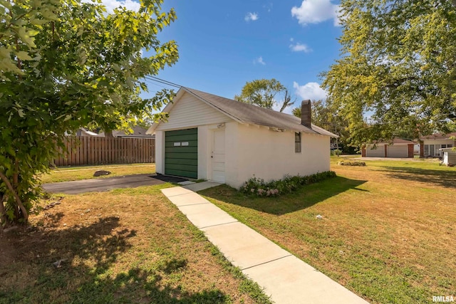 view of front of property with a garage and a front yard