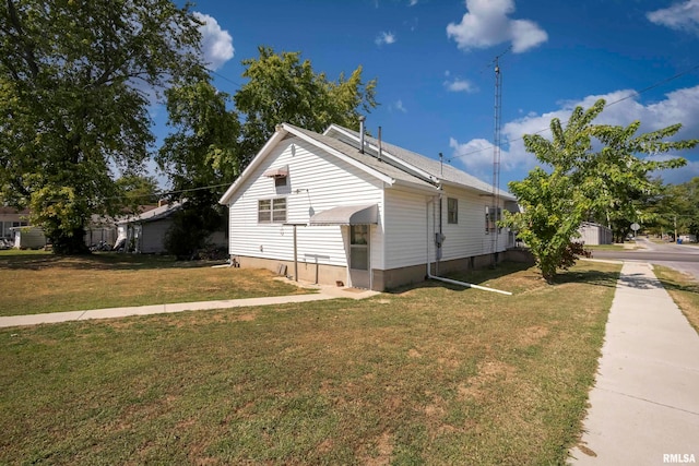 view of home's exterior featuring a yard