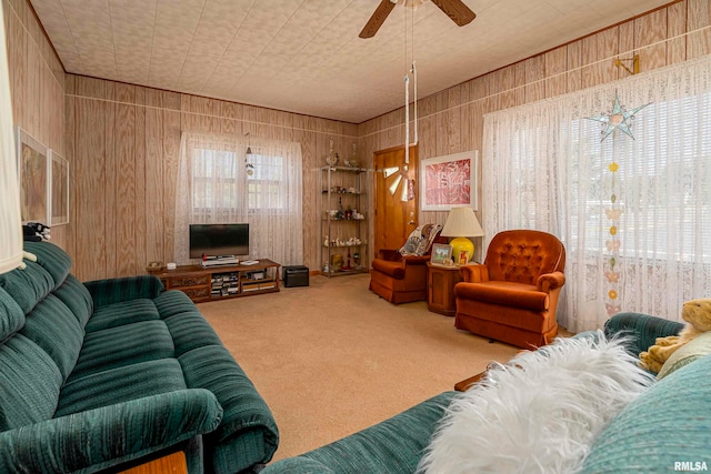 living room with carpet flooring and ceiling fan