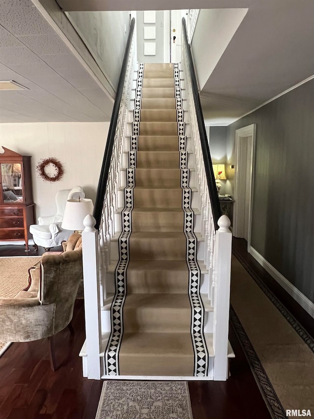 staircase featuring hardwood / wood-style flooring