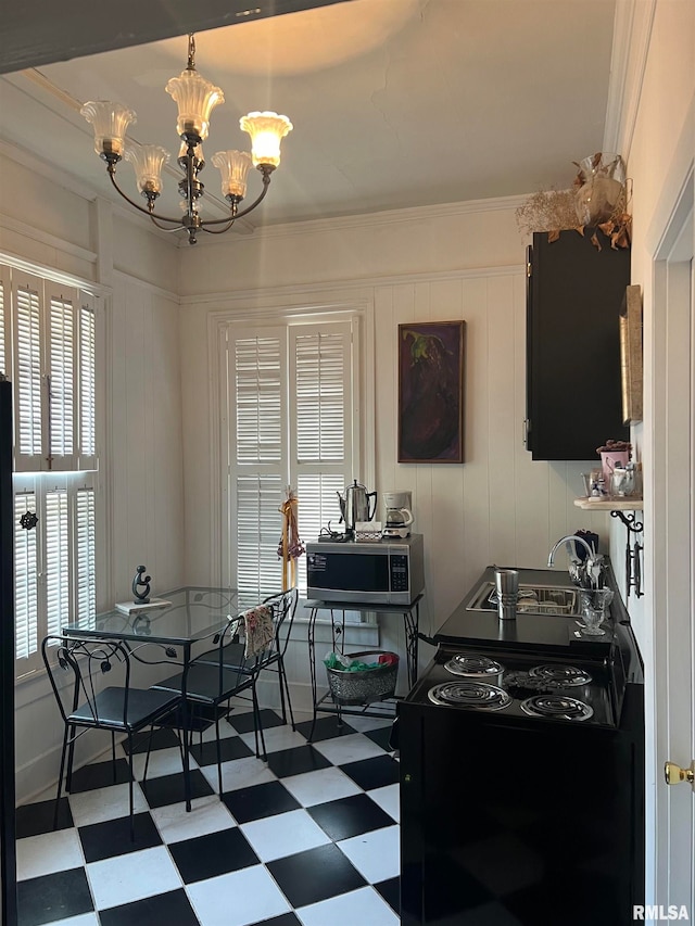 kitchen with black electric range, ornamental molding, an inviting chandelier, and sink