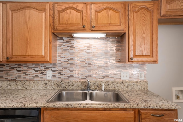 1500 Apache Dr, Marion, IL 62959 - kitchen with a sink, black dishwasher, backsplash, and light stone counters