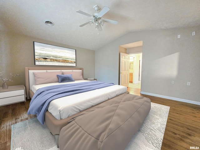 bedroom with lofted ceiling, a textured ceiling, hardwood / wood-style flooring, and ceiling fan