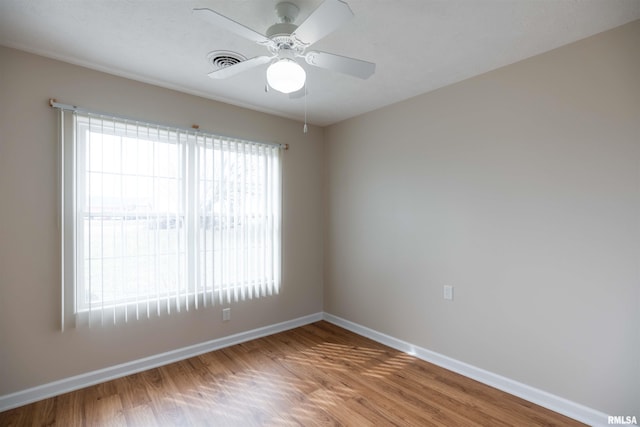 1500 Apache Dr, Marion, IL 62959 - unfurnished room with baseboards, a ceiling fan, and wood finished floors