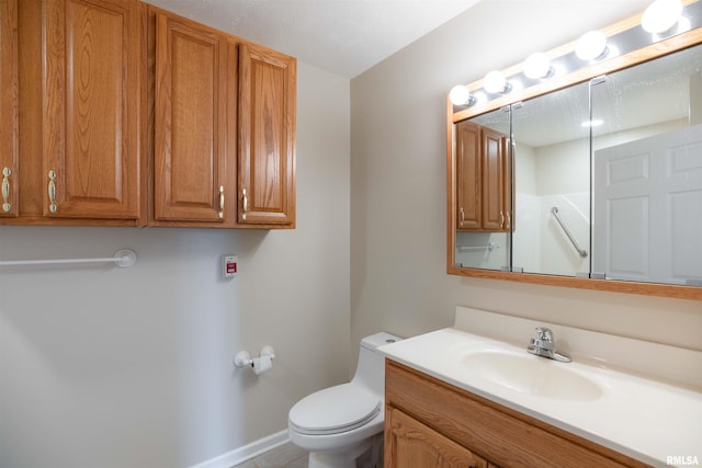 1500 Apache Dr, Marion, IL 62959 - bathroom featuring vanity, toilet, and baseboards