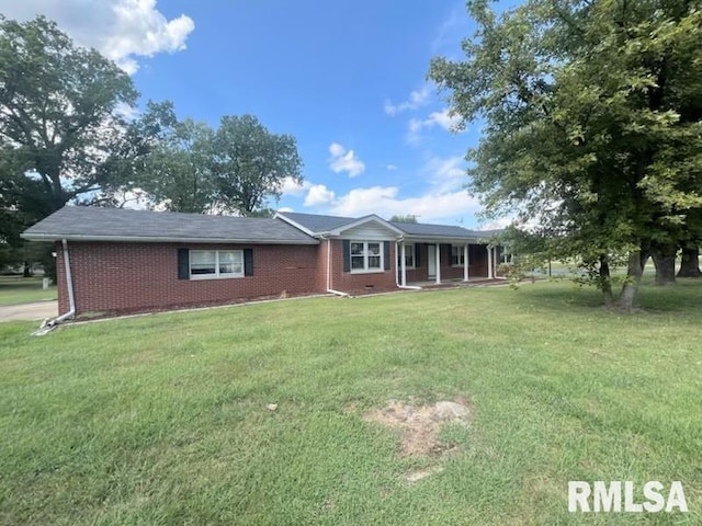 ranch-style house with a front lawn