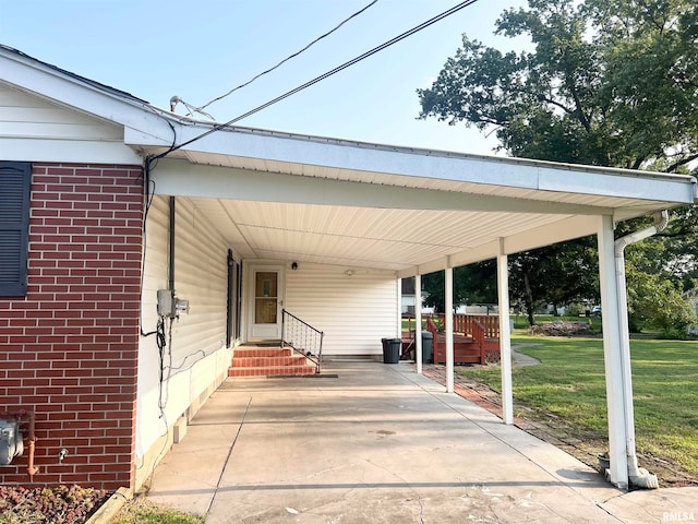 view of vehicle parking with a yard and a carport