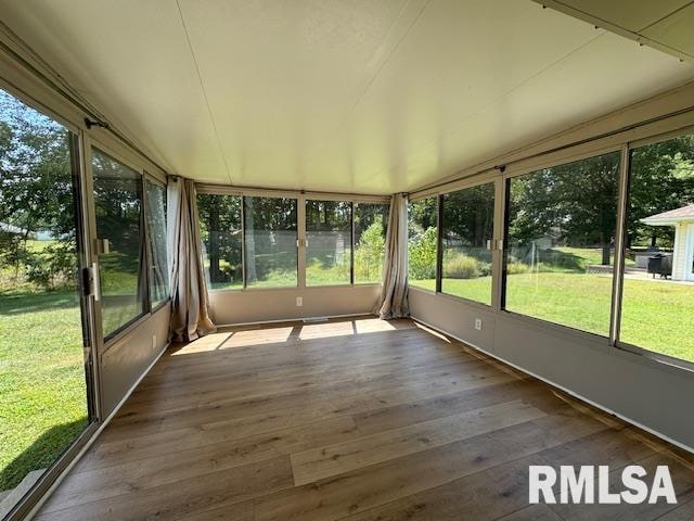 unfurnished sunroom with a healthy amount of sunlight