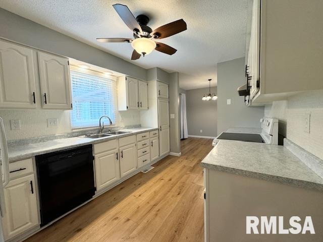 kitchen featuring hanging light fixtures, dishwasher, ceiling fan with notable chandelier, white cabinetry, and range