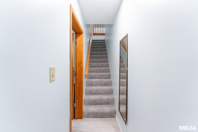 hallway with light hardwood / wood-style flooring