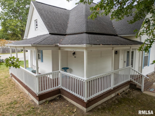 rear view of property with a porch