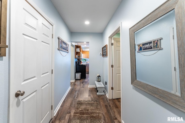 hall with dark wood-type flooring