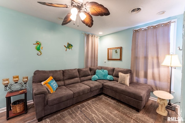 living room featuring ceiling fan and hardwood / wood-style floors