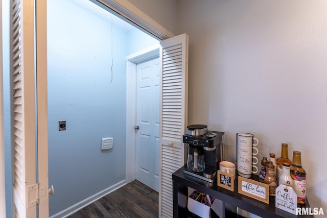 hallway featuring dark hardwood / wood-style flooring