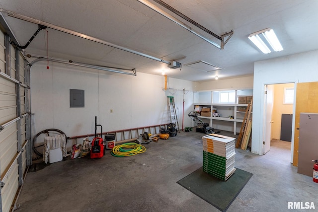 garage featuring electric panel and a garage door opener