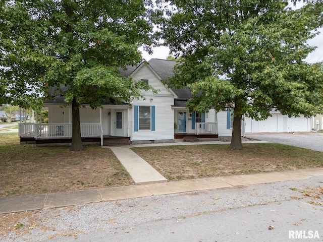 view of property hidden behind natural elements featuring a porch