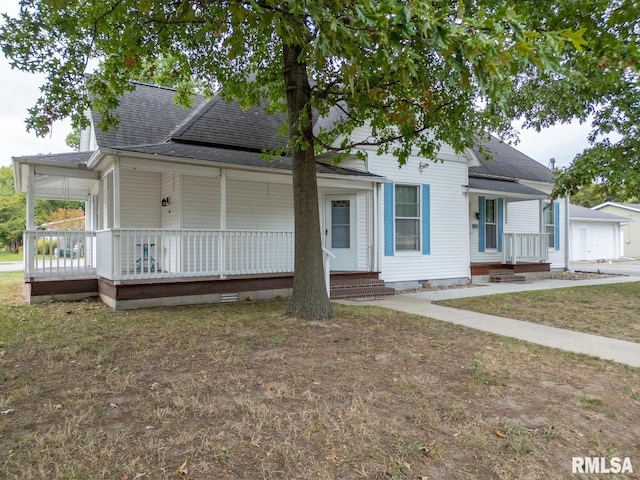 view of front facade with covered porch and a garage