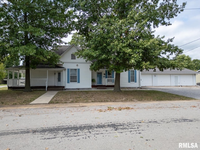 view of front of property featuring a porch and a garage