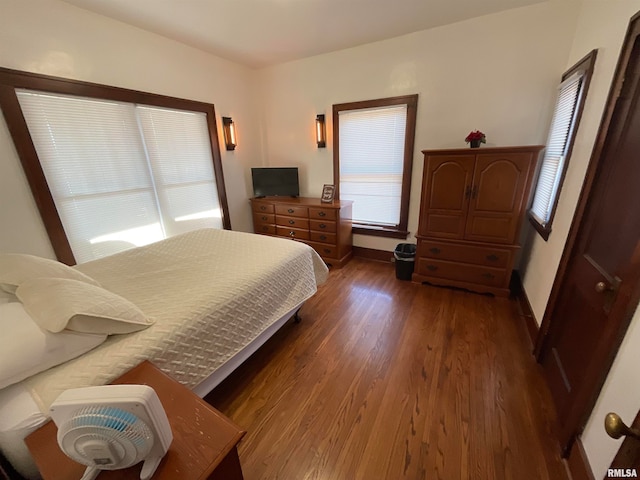 bedroom featuring dark hardwood / wood-style flooring