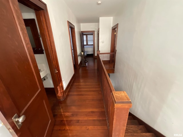 hall with dark hardwood / wood-style floors