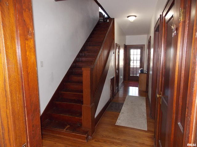 stairway featuring hardwood / wood-style floors