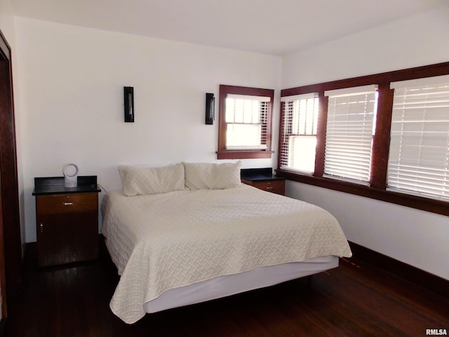 bedroom featuring dark hardwood / wood-style floors