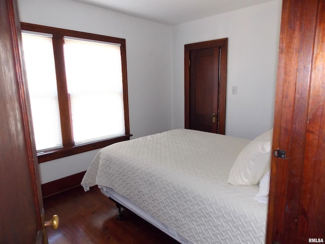 bedroom featuring dark hardwood / wood-style floors