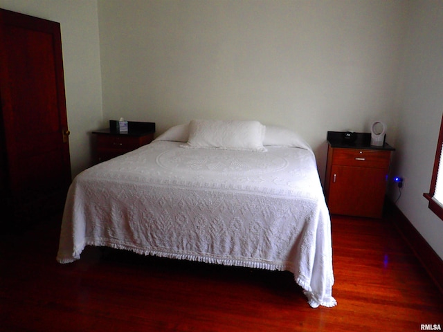 bedroom featuring dark wood-type flooring