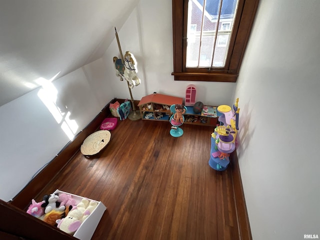 playroom with wood-type flooring and lofted ceiling