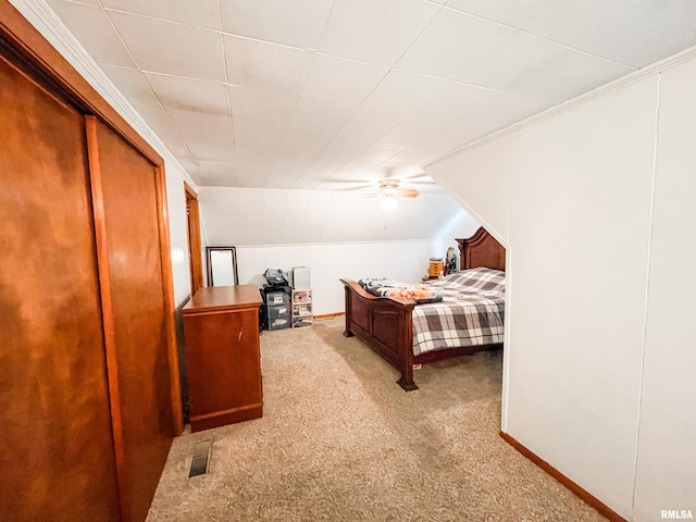 bedroom featuring crown molding, ceiling fan, and light carpet